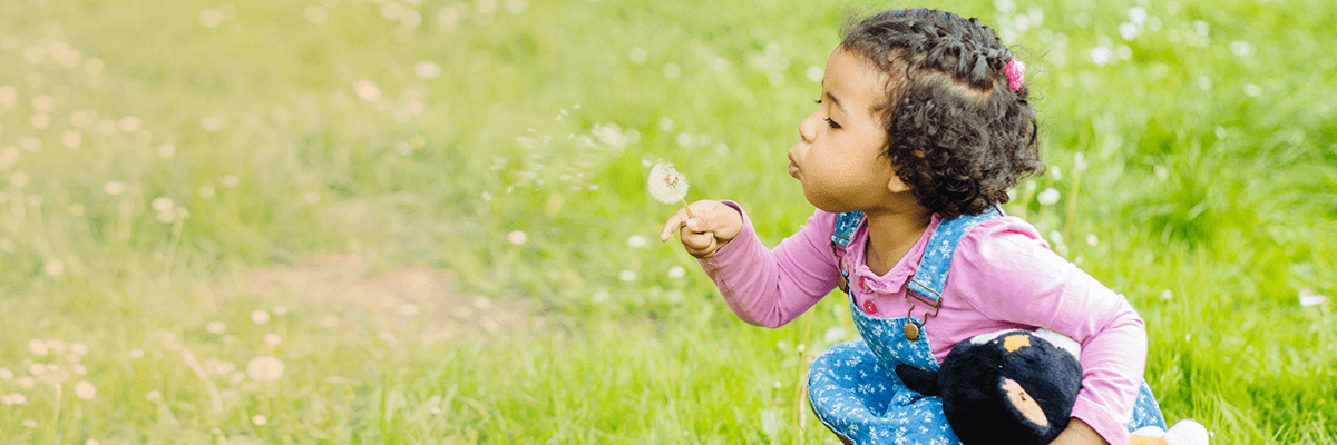 toddler blowing bubbles